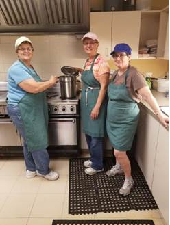 Volunteers work in the kitchen at the Strangway Centre
