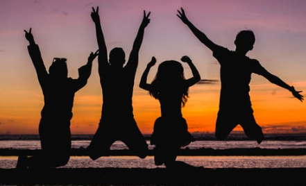 pictures of kids jumping in air on a beach