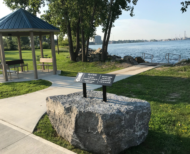 Photo of point lands ashes scattering site stone and sign.