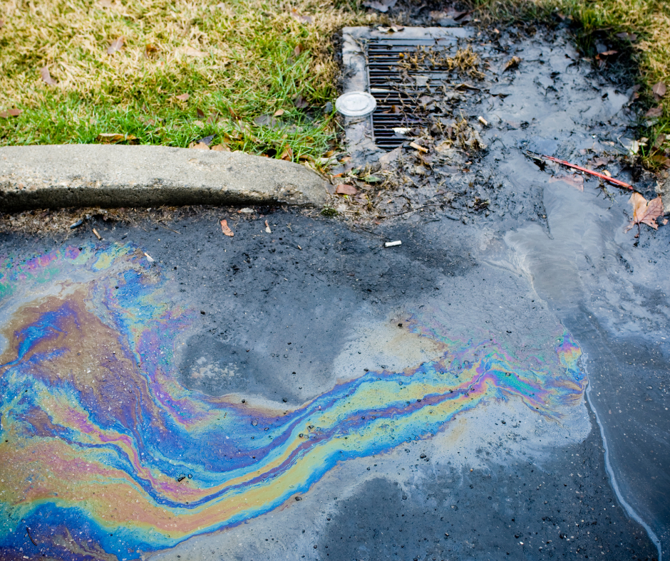oil spill on road and catch basin
