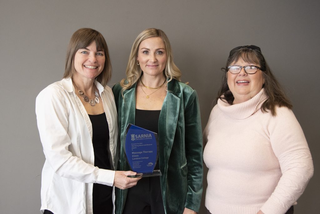 Monique VanHooft and Mel Johnson of the Lambton College Massage Therapy Clinic with SAAC member Kathleen Stinson