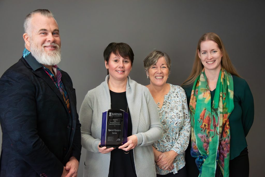 Outstanding Service in a Social Service Sector recipient Special Olympics Sarnia (SOS). Pictured from left: Coun. Brian White, Sarnia Accessibility Advisory Committee (SAAC) Council representative; Tana Manchester and Anne Lannan of SOS; Christine Wright, SAAC member.