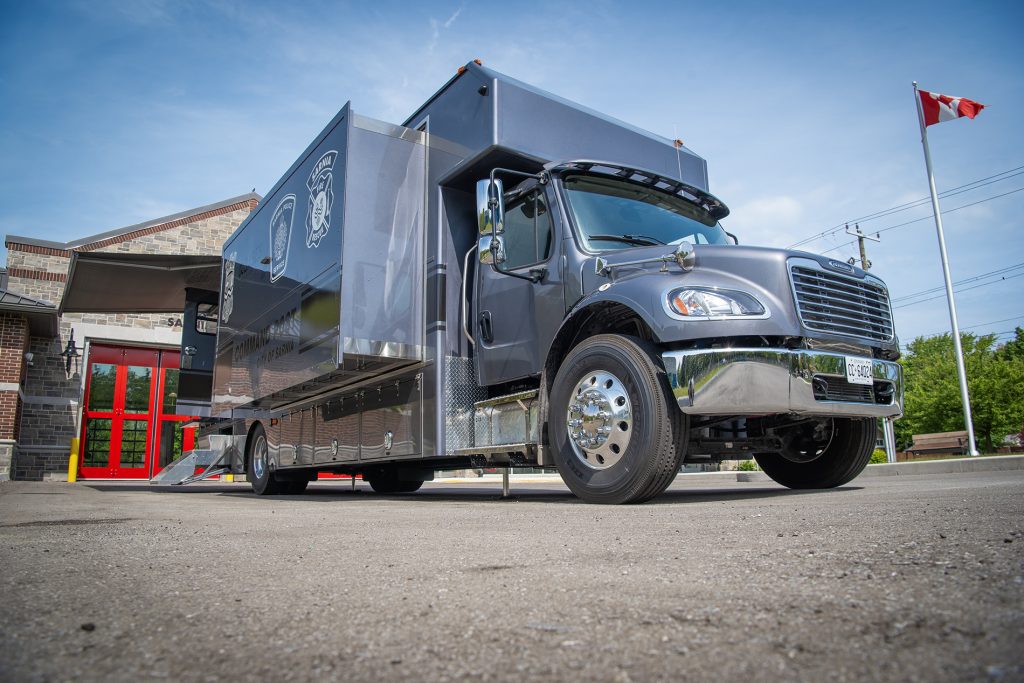 A truck with wings deployed allowing for expanded interior space.